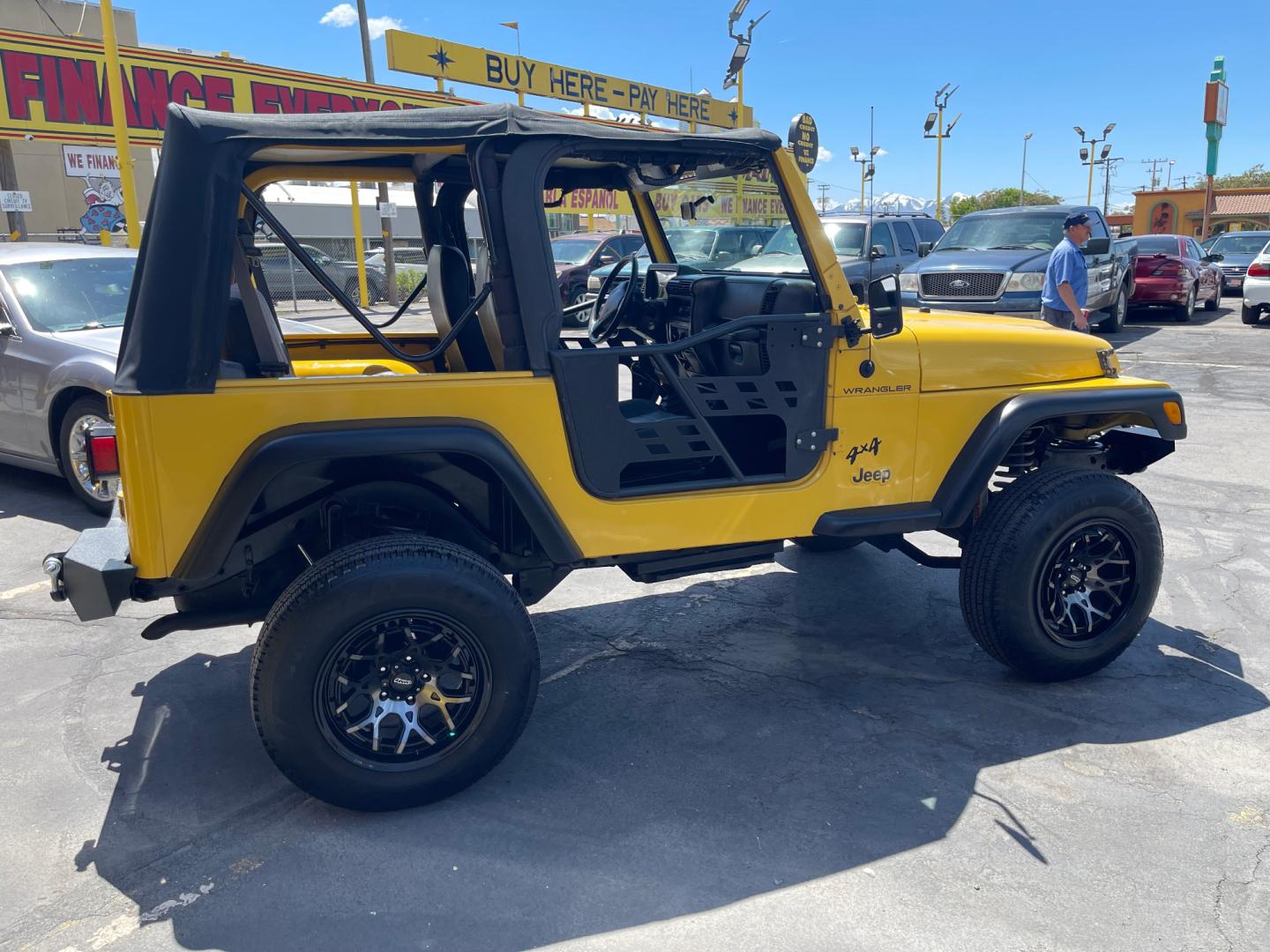 2000 Solar Yellow /Black Jeep Wrangler SE (1J4FA29P9YP) with an 2.5L 4 Cyl. engine, Manual transmission, located at 801 South State Street, Salt Lake City, UT, 84111, (801) 328-0098, 40.751953, -111.888206 - Wow extremely rare to find extra clean Jeep in immaculate condition 4x4! Low miles only 98,248 miles! Interior and exterior are both in excellent shape for the year. This is a clean title no reported accidents on the CarFax history report. It has passed emissions already and is ready to go. Featur - Photo#3